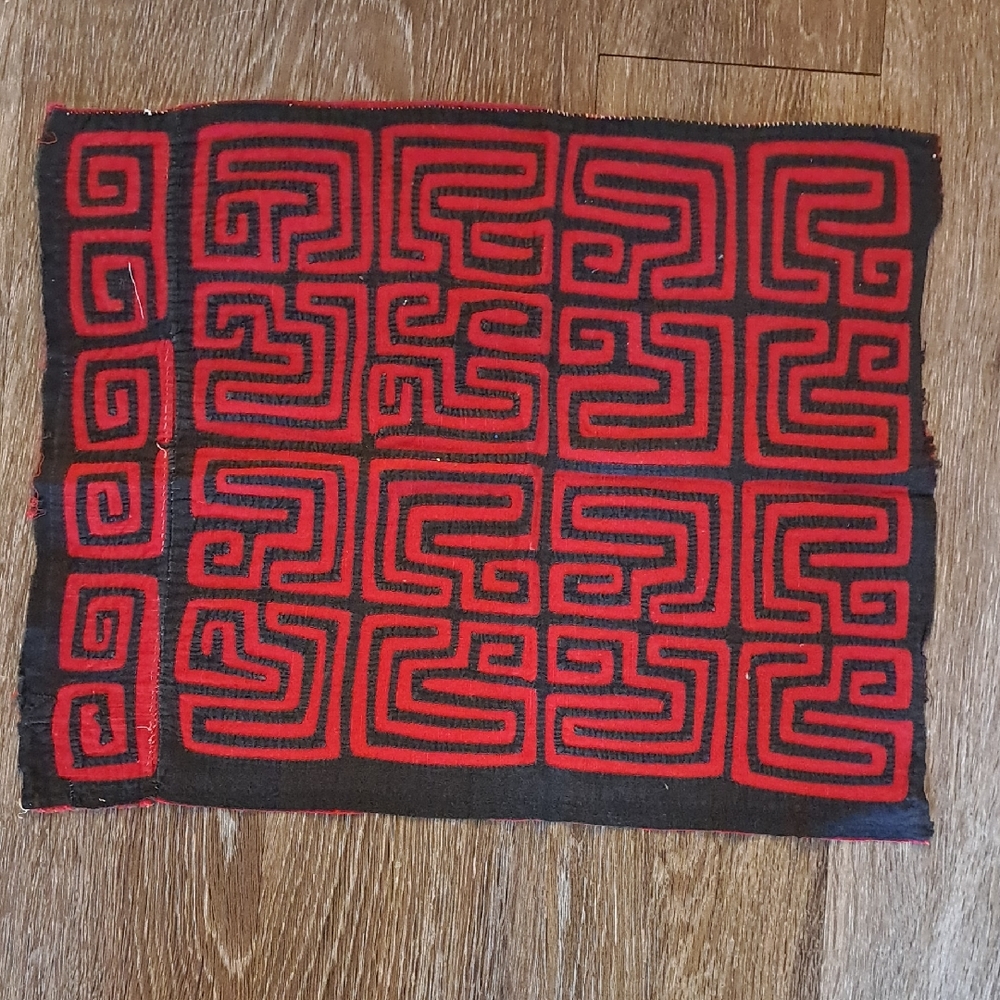 Red and Black Mola. Geometric Patterned Fabric
